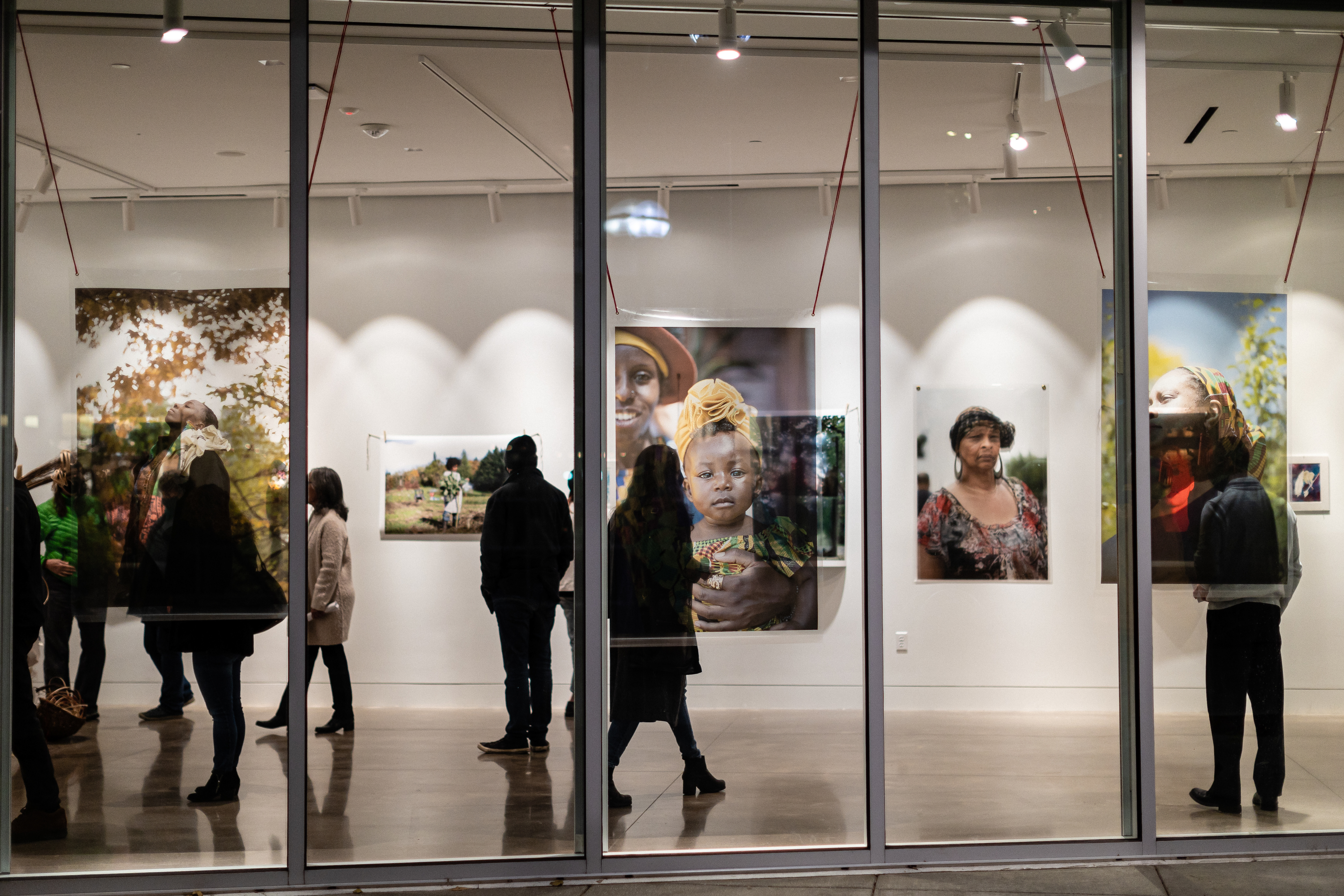 image of people walking around an art gallery