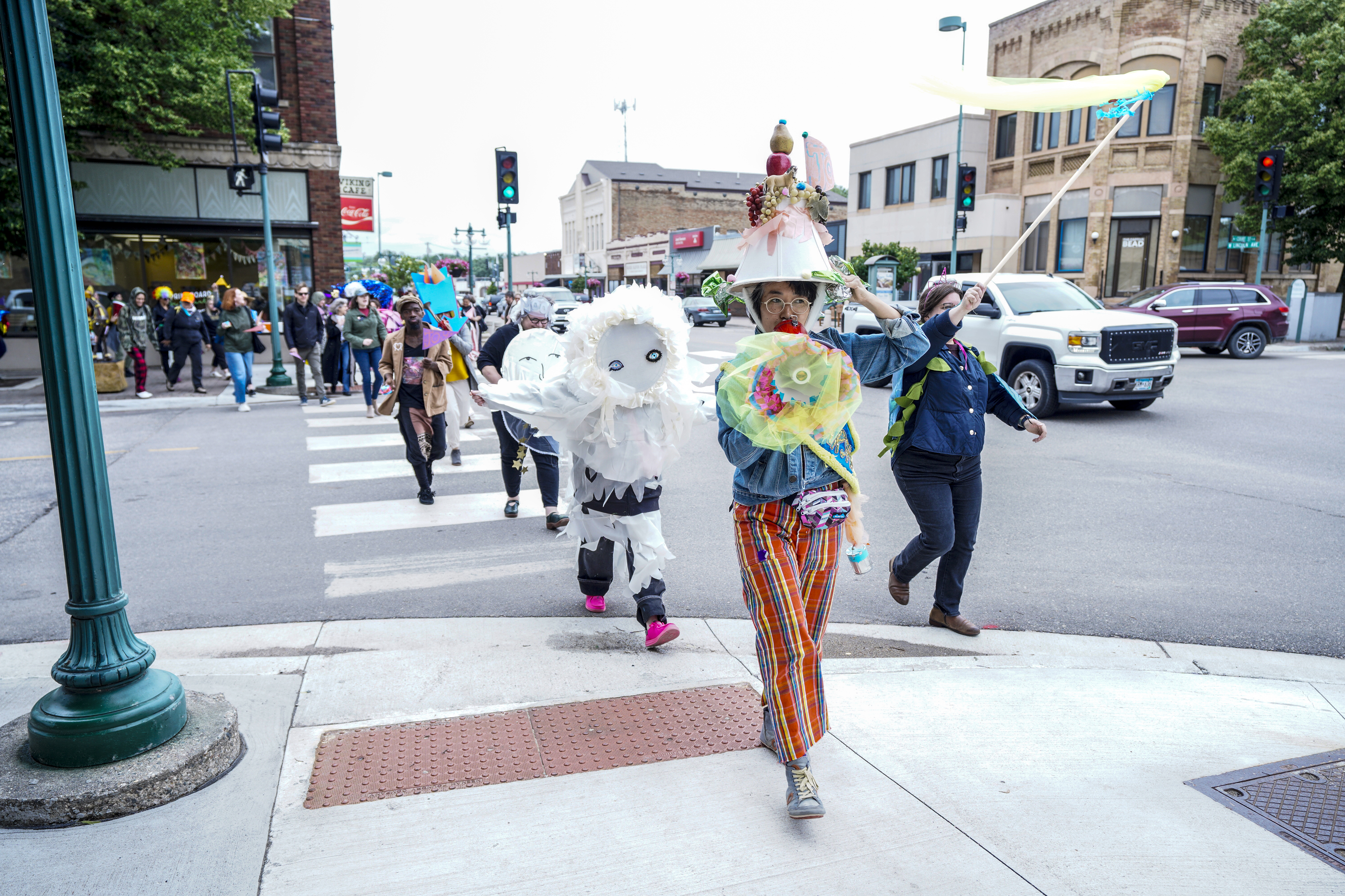 Artists participate in the Joy March in downtown Fergus Falls, July 2025